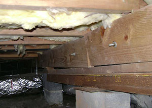 sagging crawl space with wooden shimming a Derwood crawl space