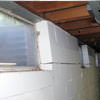 A foundation showing severe inward buckling along the windows in a Woodbridge home.