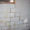 A cracked foundation wall near a window in a Bowie home