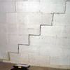 A diagonal stair step crack along the foundation wall of a Germantown home