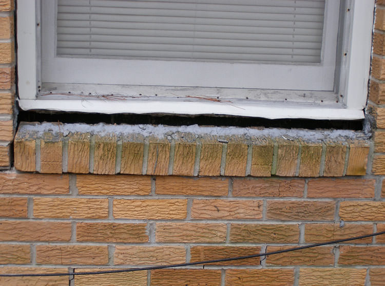 A window sill cracking and separating from the foundation wall in a Centreville home.