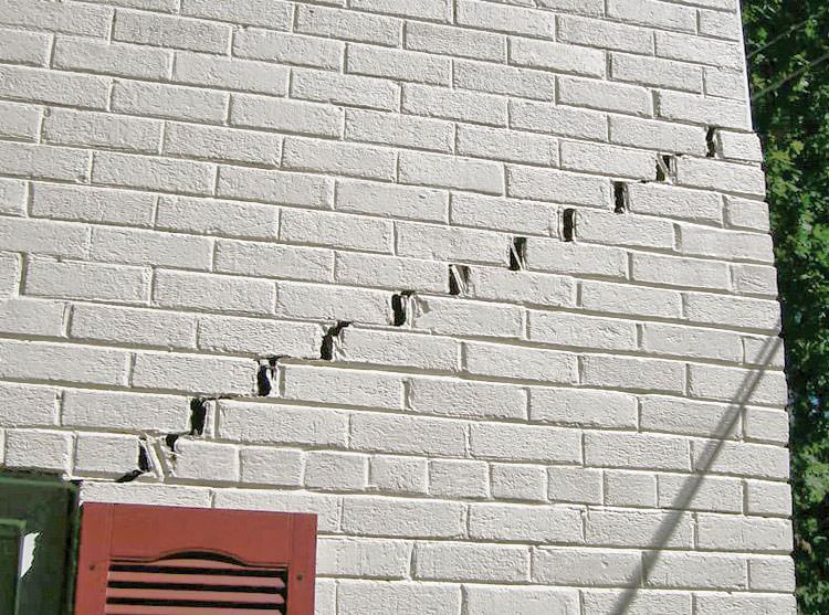 Stair-step cracks showing in a home foundation in Reston