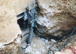 a bent, failed foundation push pier installed in Alexandria.