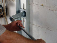 Mounting a foundation wall channel anchor in Sterling.