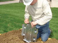 Fastening an earth anchor for a severely bowing wall in Fairfax.