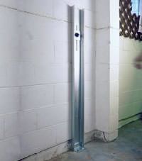 A failing foundation wall repaired with a foundation wall channel anchor system in a Ashburn home.