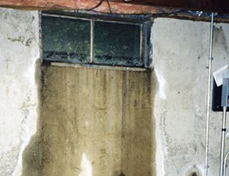 Water pouring out from a basement window in Ashburn